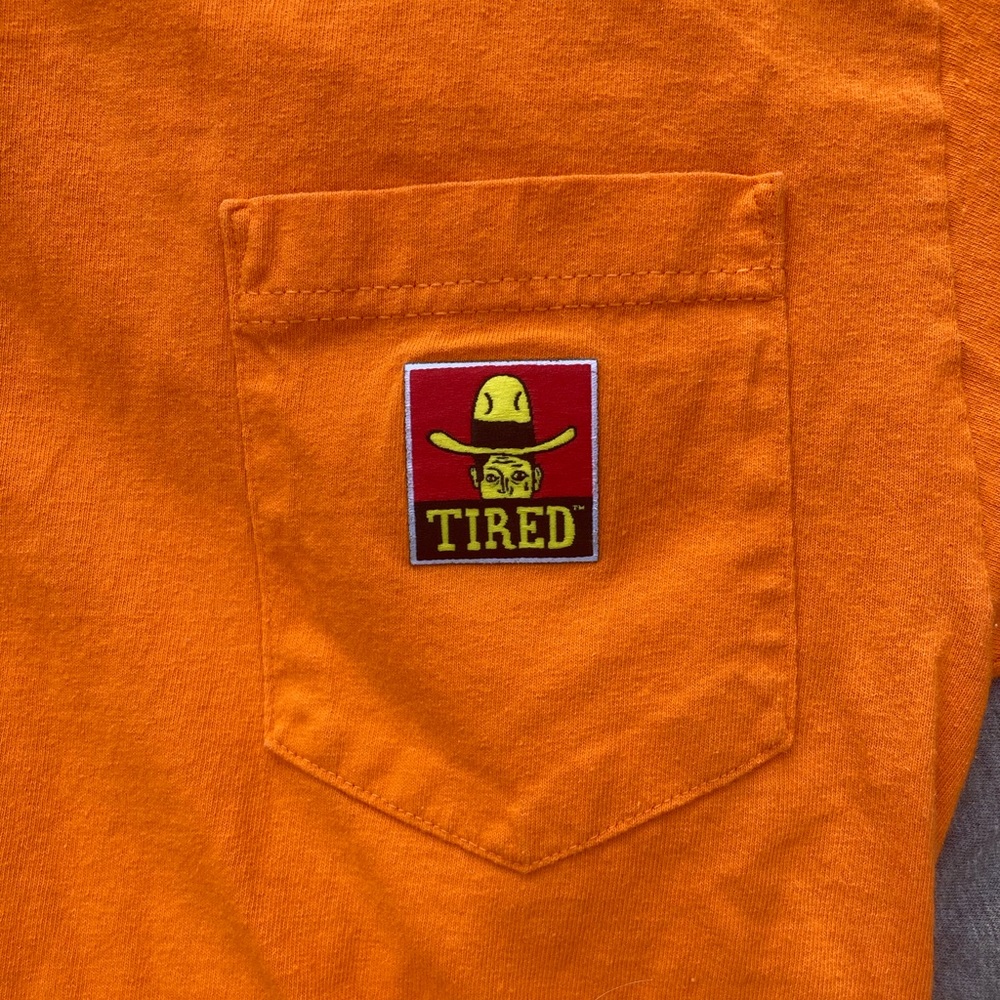 Tired skateboards pocket tee